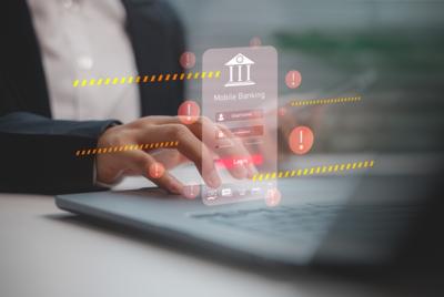 Koncepcja zagrożenia cybernetycznego w bankowości mobilnej. Ekran logowania do aplikacji bankowej otoczony symbolami wykrzykników i pasami ostrzegawczymi, sugerującymi ryzyko lub próbę phishingu.